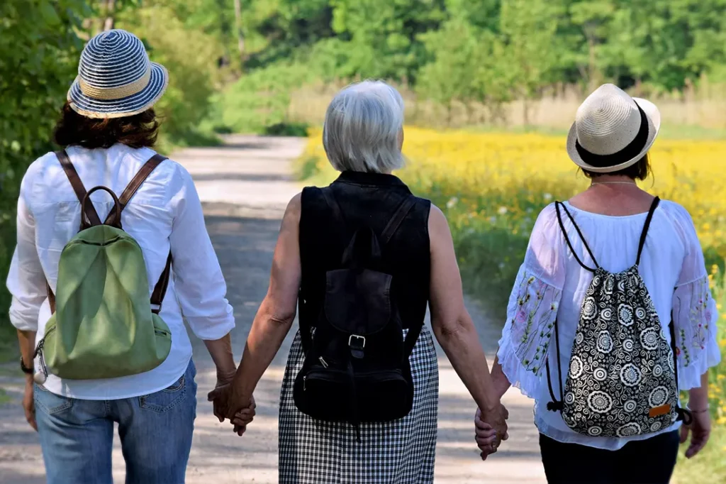 Copeland Counselling - Midlife Counselling - Midlife Women holding hands walking outside
