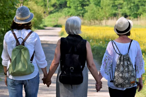 Copeland Counselling - Midlife Counselling - Midlife Women holding hands walking outside
